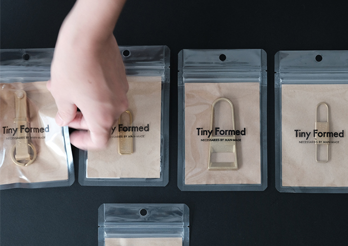 Tiny formed Two-way bottle opener